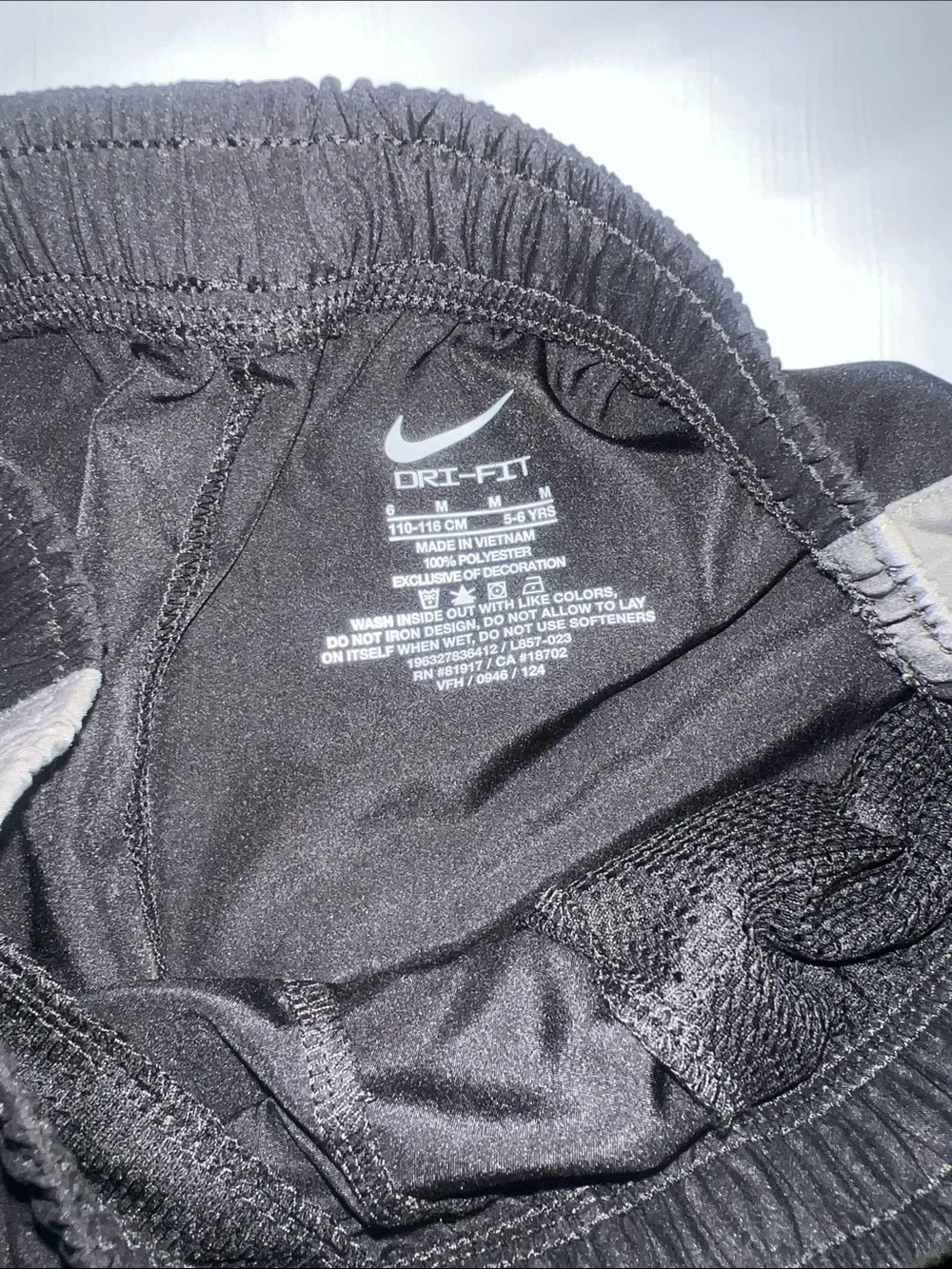 Nike Black Shorts with Gray Side Panels and White Swoosh